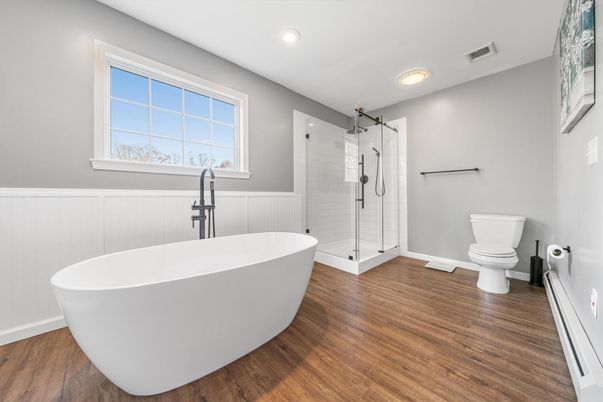 Bathroom, Free Standing Baths, Glass Shower, Interior, Recessed Lighting, Wood Texture Flooring