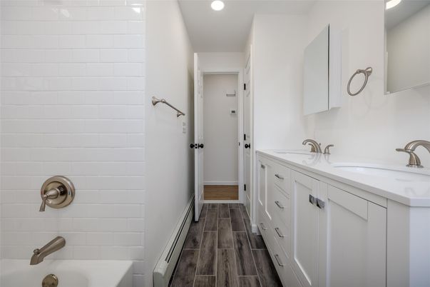 Bathroom, Dual Sink Vanities, Interior, Recessed Lighting, Wood Texture Flooring
