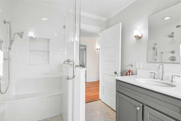 Bathroom, Dual Sink Vanities, Glass Shower, Interior, Recessed Lighting, Wood Texture Flooring