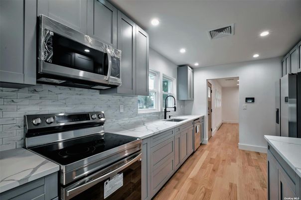 Interior, Kitchen, Recessed Lighting, Stainless Steel Appliances, Wood Texture Flooring
