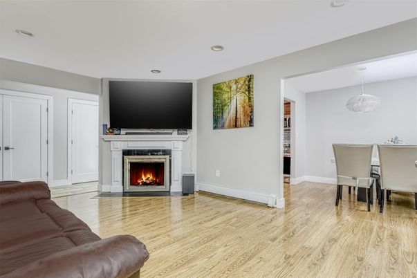 Dining room, Fireplace, Interior, Living room, Pendant Lights, Recessed Lighting, Wood Texture Flooring