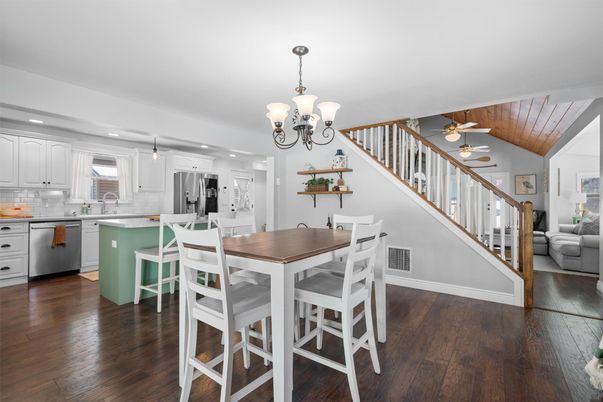 Chandelier, Dining room, Interior, Kitchen, Pendant Lights, Recessed Lighting, Stainless Steel Appliances, Wood Texture Flooring