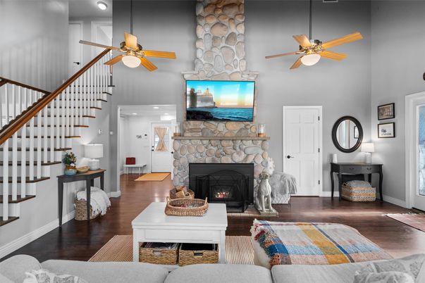Fireplace, Interior, Living room, Recessed Lighting, Stone Walls, Wood Texture Flooring