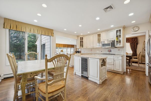 Dining room, Interior, Kitchen, Recessed Lighting, Stainless Steel Appliances, Wood Texture Flooring