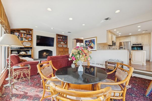 Dining room, Fireplace, Interior, Kitchen, Living room, Recessed Lighting, Stainless Steel Appliances, Wood Texture Flooring