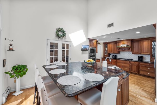 Dining room, Interior, Kitchen, Recessed Lighting, Stainless Steel Appliances, Wood Texture Flooring