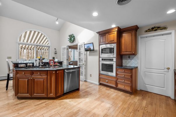 Dining room, Interior, Kitchen, Recessed Lighting, Stainless Steel Appliances, Wood Texture Flooring