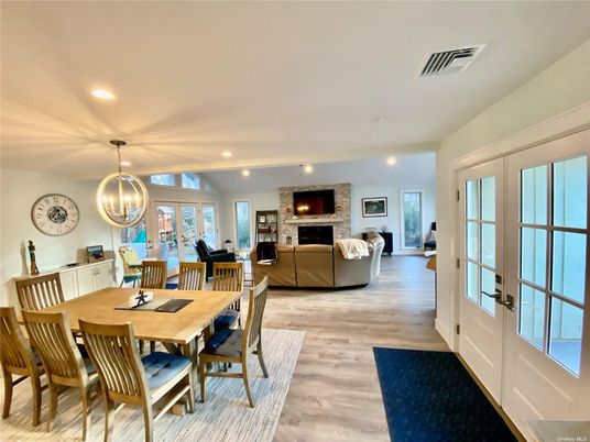 Dining room, Fireplace, Interior, Living room, Recessed Lighting, Wood Texture Flooring