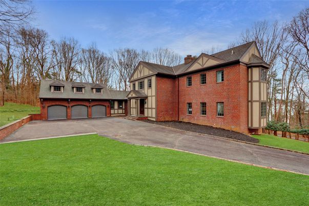 Attached, Backyard, Exterior, Facade, Brick Facade, Tudor Revival