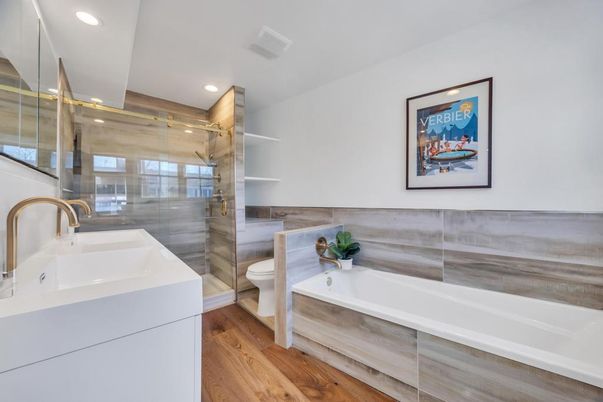 Bathroom, Dual Sink Vanities, Glass Shower, Interior, Recessed Lighting, Wood Texture Flooring