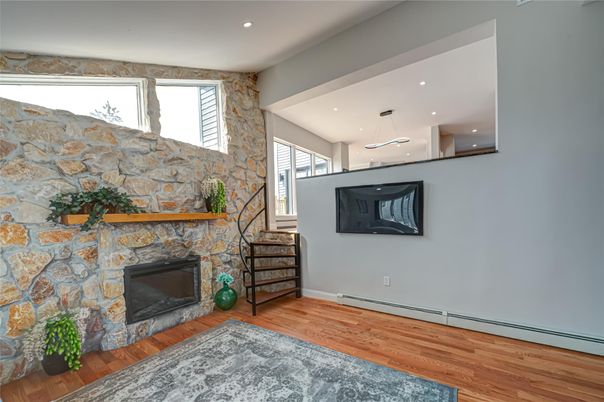 Fireplace, Interior, Pendant Lights, Recessed Lighting, Stone Walls, Wood Texture Flooring