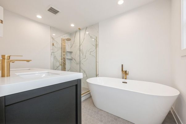 Bathroom, Dual Sink Vanities, Free Standing Baths, Glass Shower, Interior, Marble Walls, Recessed Lighting