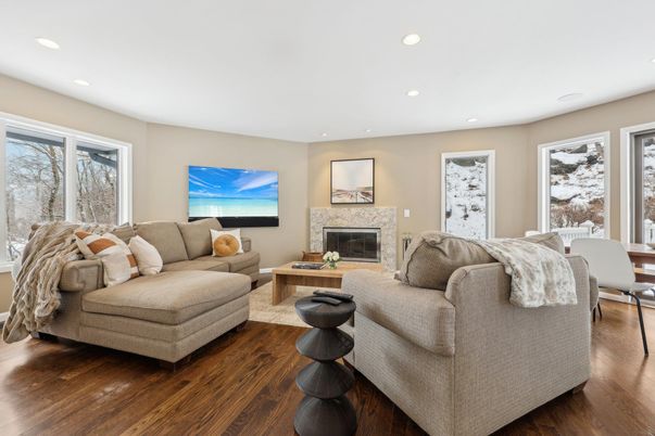 Dining room, Fireplace, Interior, Living room, Recessed Lighting, Wood Texture Flooring
