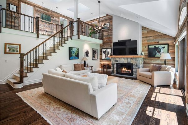 Chandelier, Fireplace, Interior, Living room, Pendant Lights, Recessed Lighting, Wood Texture Flooring, Wooden Walls