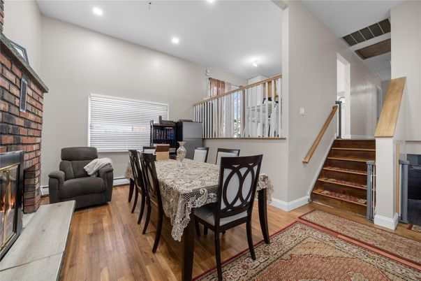 Dining room, Fireplace, Interior, Recessed Lighting, Stone Walls, Wood Texture Flooring