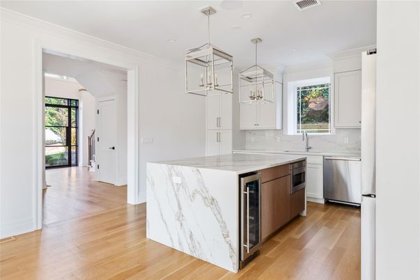 Interior, Kitchen, Marble Walls, Pendant Lights, Recessed Lighting, Stainless Steel Appliances, Wood Texture Flooring