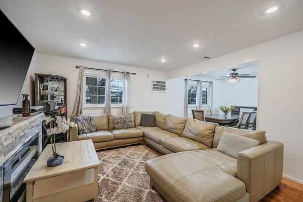 Dining room, Fireplace, Interior, Living room, Recessed Lighting, Wood Texture Flooring