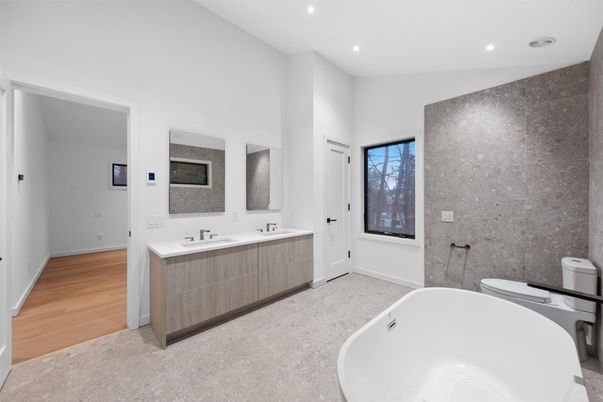 Bathroom, Dual Sink Vanities, Free Standing Baths, Interior, Recessed Lighting, Wood Texture Flooring