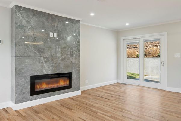 Fireplace, Interior, Marble Walls, Recessed Lighting, Wood Texture Flooring