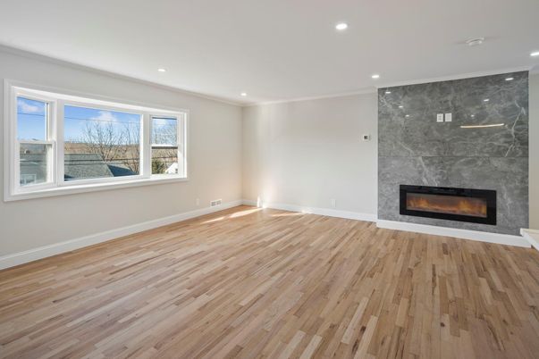 Empty room, Fireplace, Interior, Marble Walls, Recessed Lighting, Wood Texture Flooring