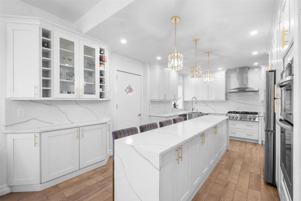 Interior, Kitchen, Marble Walls, Pendant Lights, Recessed Lighting, Stainless Steel Appliances, Wood Texture Flooring
