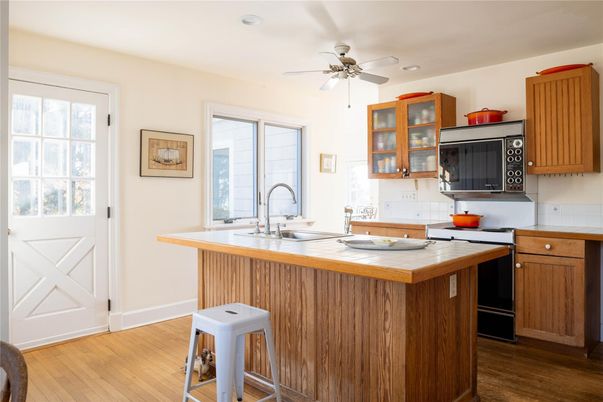 Interior, Kitchen, Recessed Lighting, Tile Countertops, Wood Texture Flooring