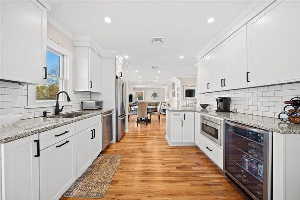 Dining room, Interior, Kitchen, Recessed Lighting, Stainless Steel Appliances, Wood Texture Flooring