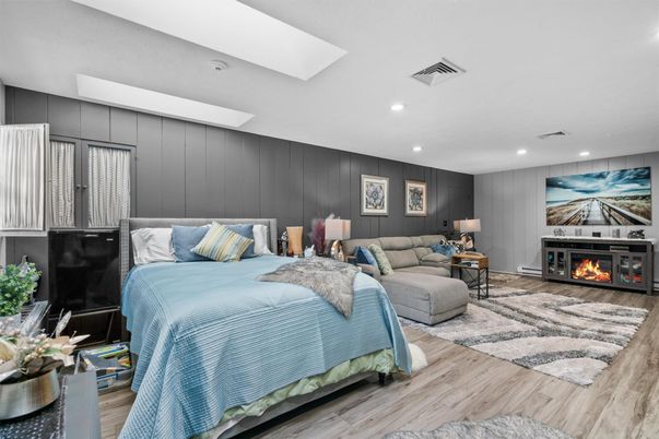 Bedroom, Fireplace, Interior, Recessed Lighting, Wood Texture Flooring