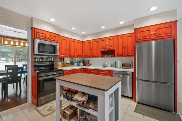 Dining room, Interior, Kitchen, Recessed Lighting, Stainless Steel Appliances, Wood Texture Flooring