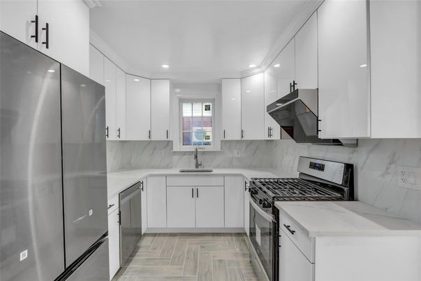Interior, Kitchen, Marble Walls, Recessed Lighting, Stainless Steel Appliances, Wood Texture Flooring