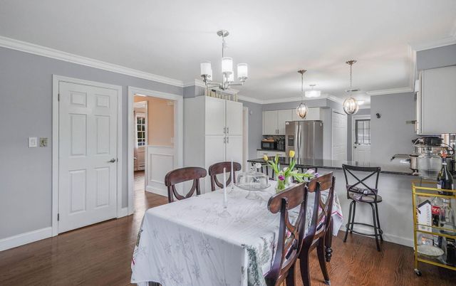 Chandelier, Dining room, Interior, Kitchen, Pendant Lights, Stainless Steel Appliances, Wood Texture Flooring
