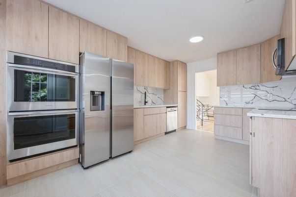 Interior, Kitchen, Marble Walls, Recessed Lighting, Stainless Steel Appliances