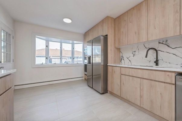 Interior, Kitchen, Marble Walls, Recessed Lighting, Stainless Steel Appliances