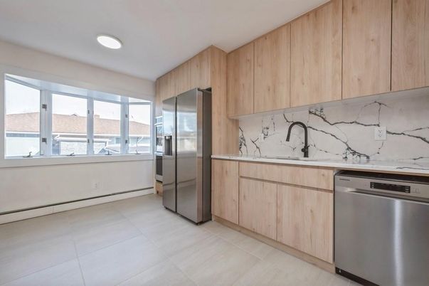 Interior, Kitchen, Marble Walls, Recessed Lighting, Stainless Steel Appliances