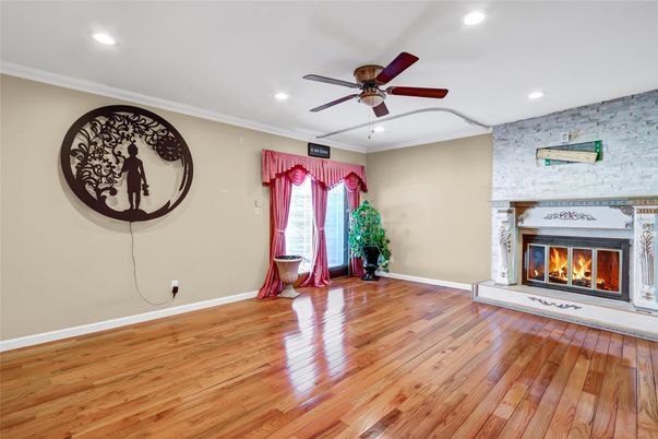 Empty room, Fireplace, Interior, Recessed Lighting, Stone Walls, Wood Texture Flooring