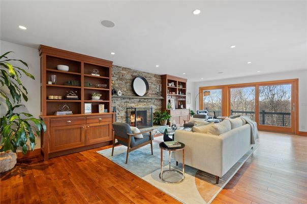 Fireplace, Interior, Living room, Recessed Lighting, Stone Walls, Wood Texture Flooring