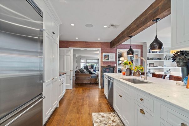 Fireplace, Interior, Kitchen, Living room, Pendant Lights, Recessed Lighting, Stainless Steel Appliances, Stone Walls, Wooden Beams, Wood Texture Flooring