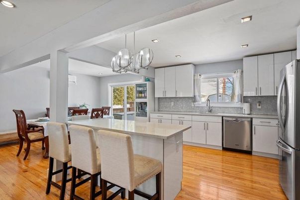 Chandelier, Dining room, Interior, Kitchen, Pendant Lights, Recessed Lighting, Stainless Steel Appliances, Wood Texture Flooring