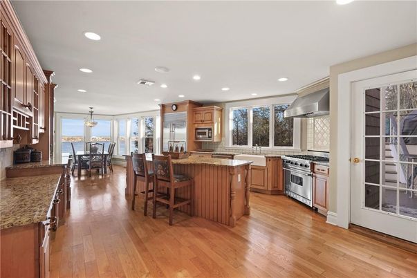 Chandelier, Dining room, Interior, Kitchen, Pendant Lights, Recessed Lighting, Stainless Steel Appliances, Wood Texture Flooring