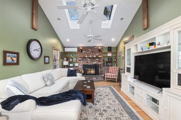 Fireplace, Interior, Living room, Recessed Lighting, Stone Walls, Wood Texture Flooring