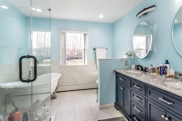 Bathroom, Dual Sink Vanities, Free Standing Baths, Glass Shower, Interior, Marble Walls, Recessed Lighting