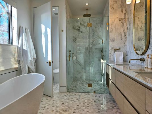 Bathroom, Dual Sink Vanities, Free Standing Baths, Glass Shower, Interior, Marble Walls, Recessed Lighting