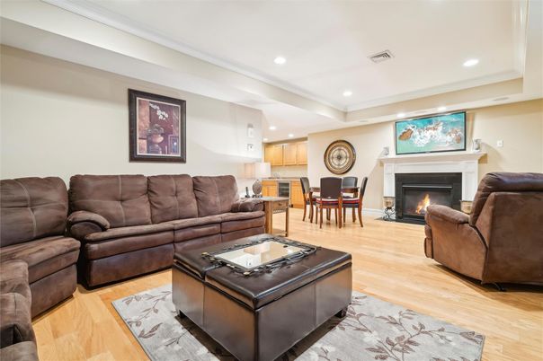 Dining room, Fireplace, Interior, Living room, Recessed Lighting, Wood Texture Flooring