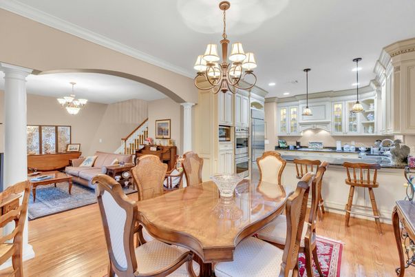 Chandelier, Dining room, Interior, Kitchen, Living room, Pendant Lights, Recessed Lighting, Stainless Steel Appliances, Wood Texture Flooring