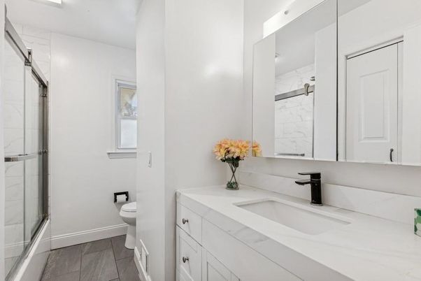 Bathroom, Dual Sink Vanities, Glass Shower, Interior, Marble Walls, Wood Texture Flooring