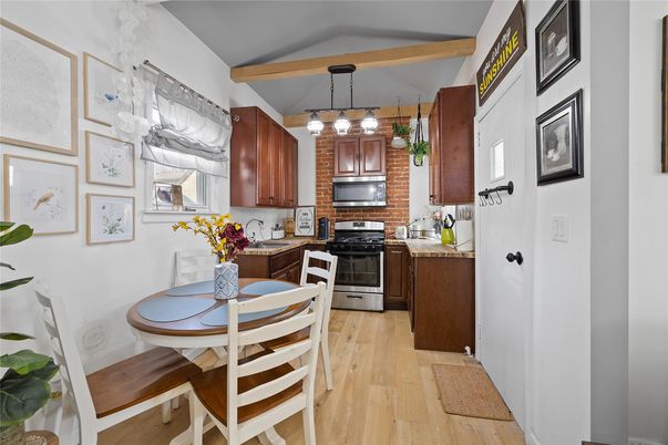 Dining room, Interior, Kitchen, Pendant Lights, Stainless Steel Appliances, Wooden Beams, Wood Texture Flooring