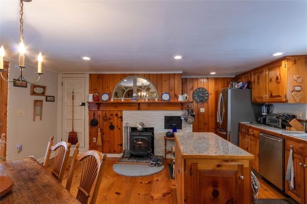 Chandelier, Fireplace, Interior, Kitchen, Recessed Lighting, Wood Texture Flooring