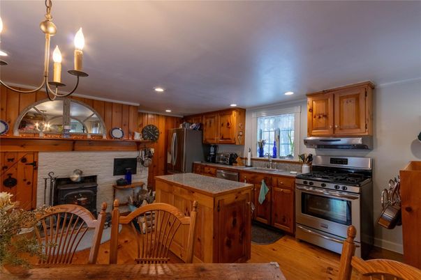 Fireplace, Interior, Kitchen, Pendant Lights, Recessed Lighting, Stainless Steel Appliances, Wood Texture Flooring