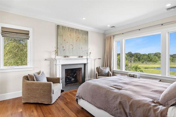 Bedroom, Fireplace, Interior, Recessed Lighting, Water, Wood Texture Flooring