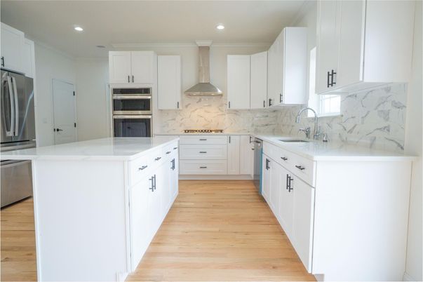 Interior, Kitchen, Marble Walls, Recessed Lighting, Stainless Steel Appliances, Wood Texture Flooring